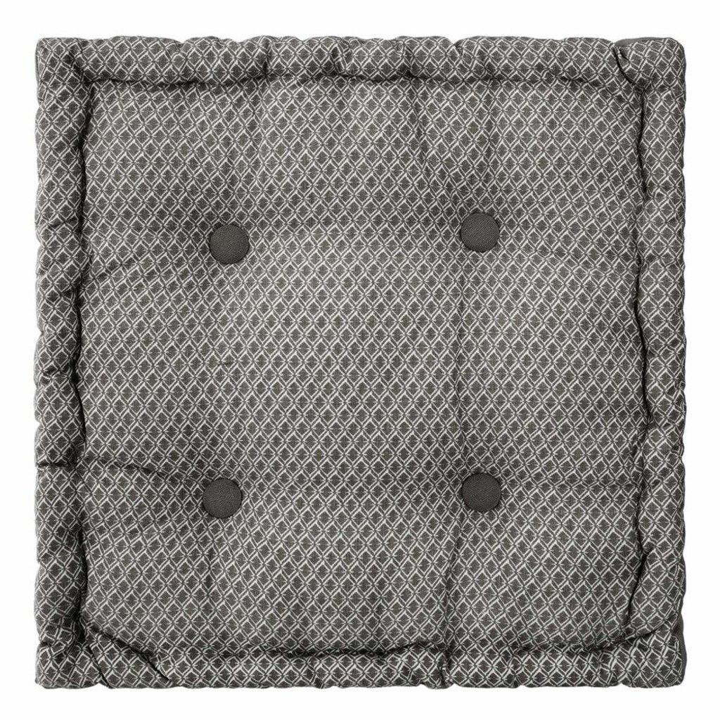 A square floor cushion with a geometric pattern and tufted buttons.