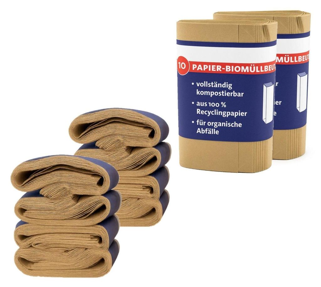 Two rolls of paper bin liners are shown, with a stack of folded bin liners in the foreground.