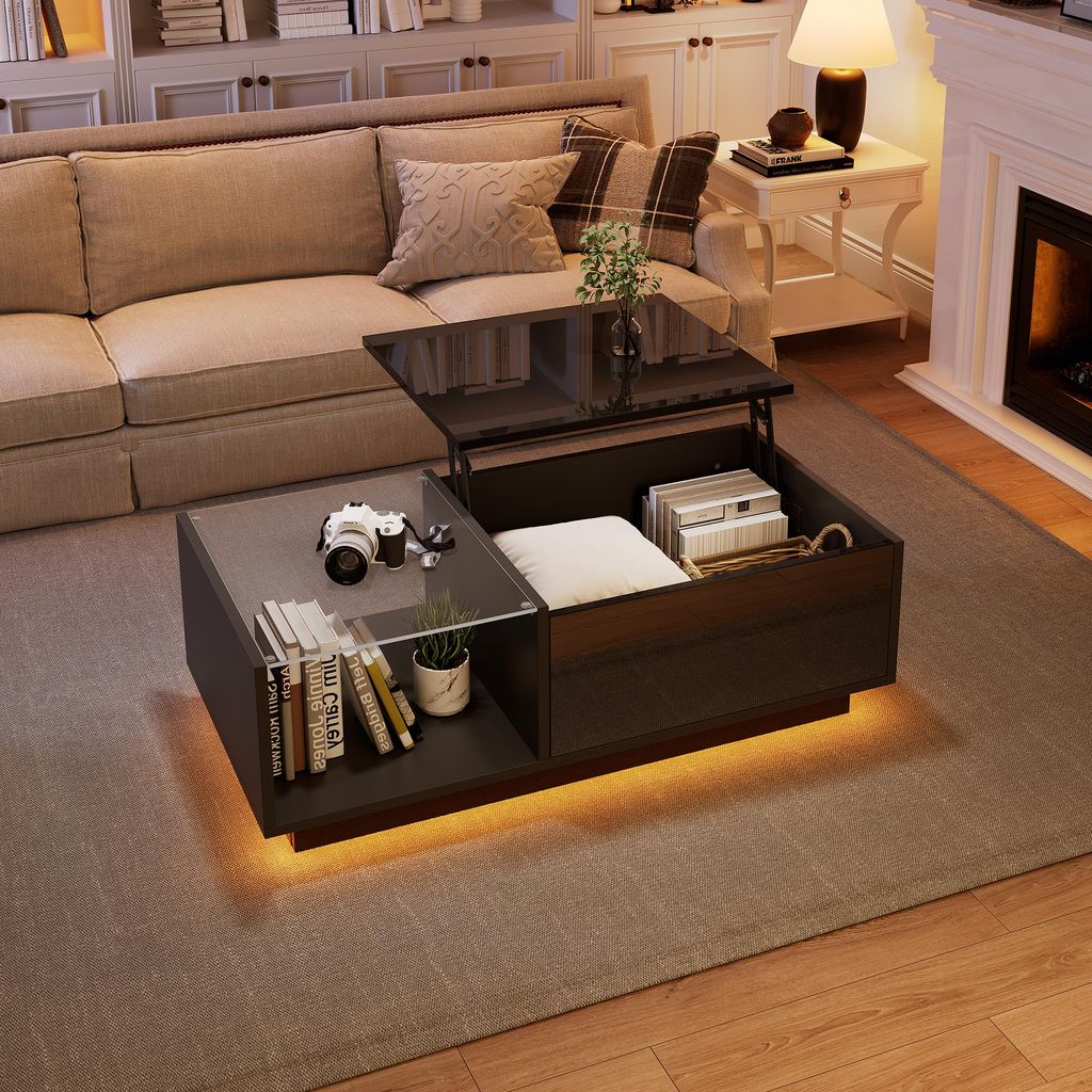 A living room scene featuring a modern coffee table with a lift-top feature, placed in front of a couch and near a fireplace.