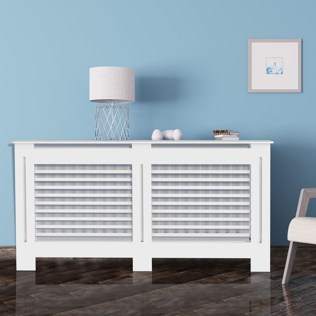 A white radiator cover with a shelf on top, placed against a light blue wall.