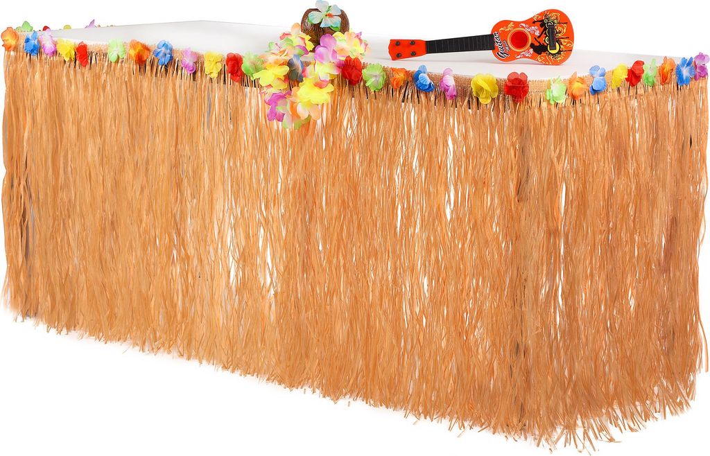 A table decorated with a grass skirt and leis, with a toy ukulele on top.
