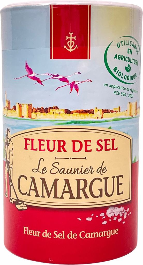 A cylindrical container of Fleur de Sel with a scenic illustration and text labels.