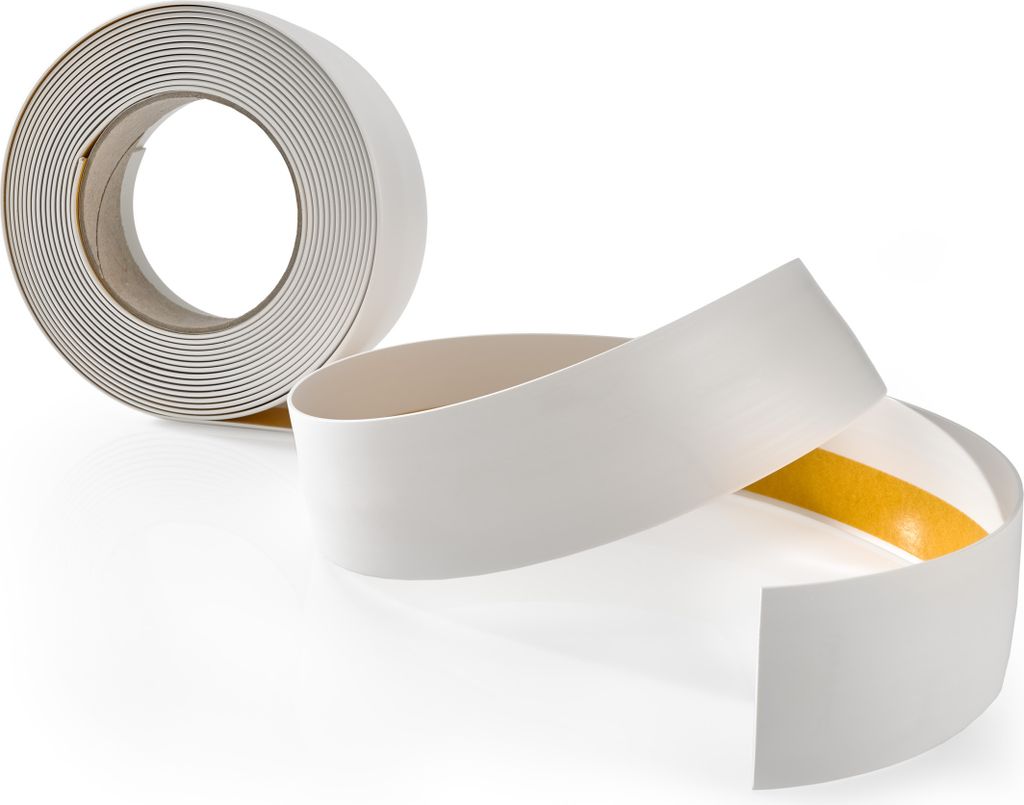A roll of white adhesive tape and a section of the tape unrolled, showing the yellow adhesive side.