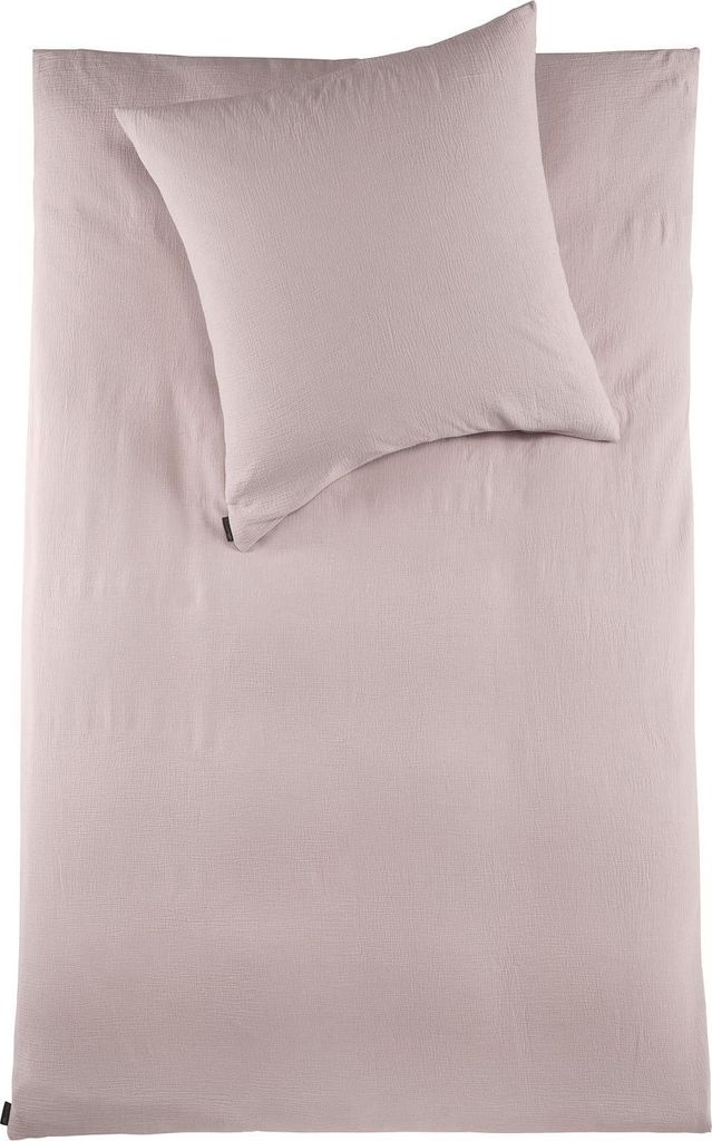 A flat lay of a pink duvet cover and a pillowcase.