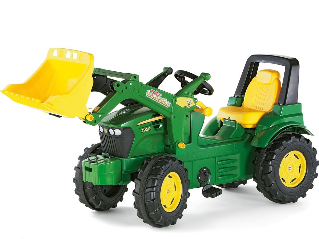 A green and yellow toy tractor with a front loader, shown against a white background.