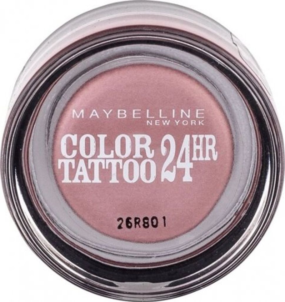 A top-down view of a small, round makeup pot with a clear lid.