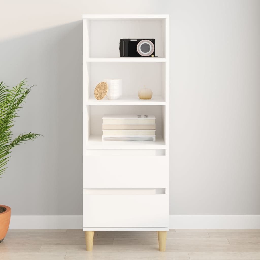 A white highboard with wooden legs is shown against a light gray wall.