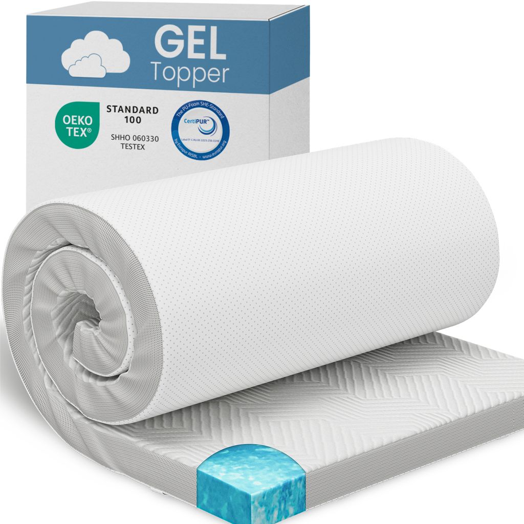 A rolled-up white gel mattress topper is displayed with its packaging in the background.