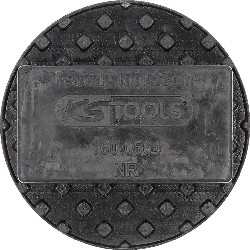A close-up, top-down view of a black rubber pad with embossed diamond patterns and a central rectangular section containing text and a logo.