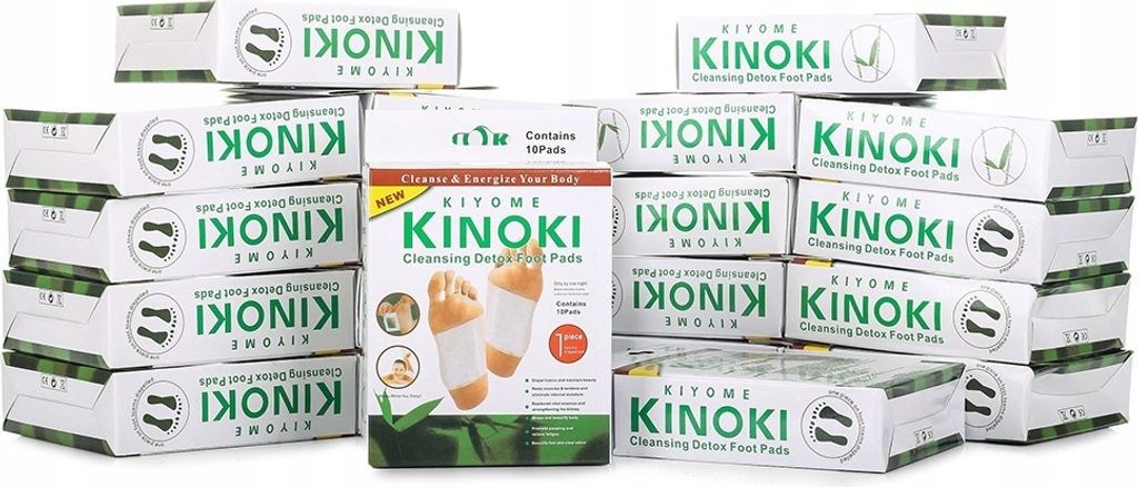 A collection of Kinoki Detox Foot Pads boxes stacked and arranged.