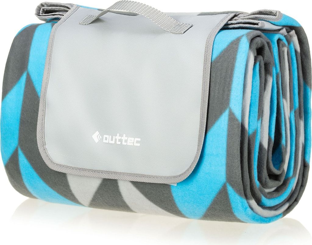 A rolled-up picnic blanket with a geometric pattern.