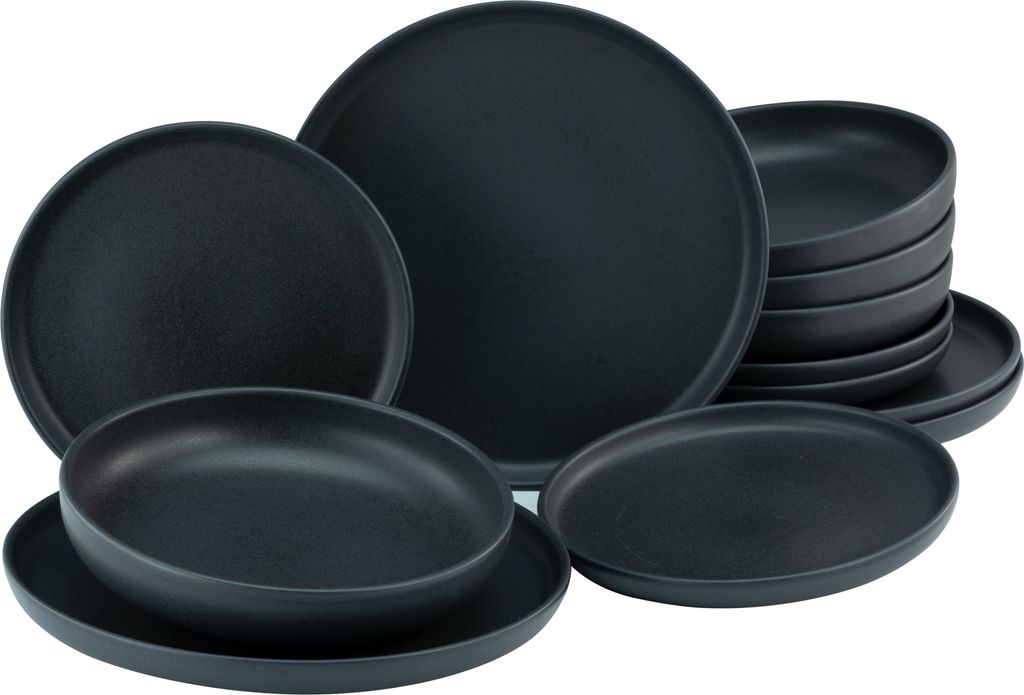 A set of black stoneware plates and bowls are arranged on a white background.