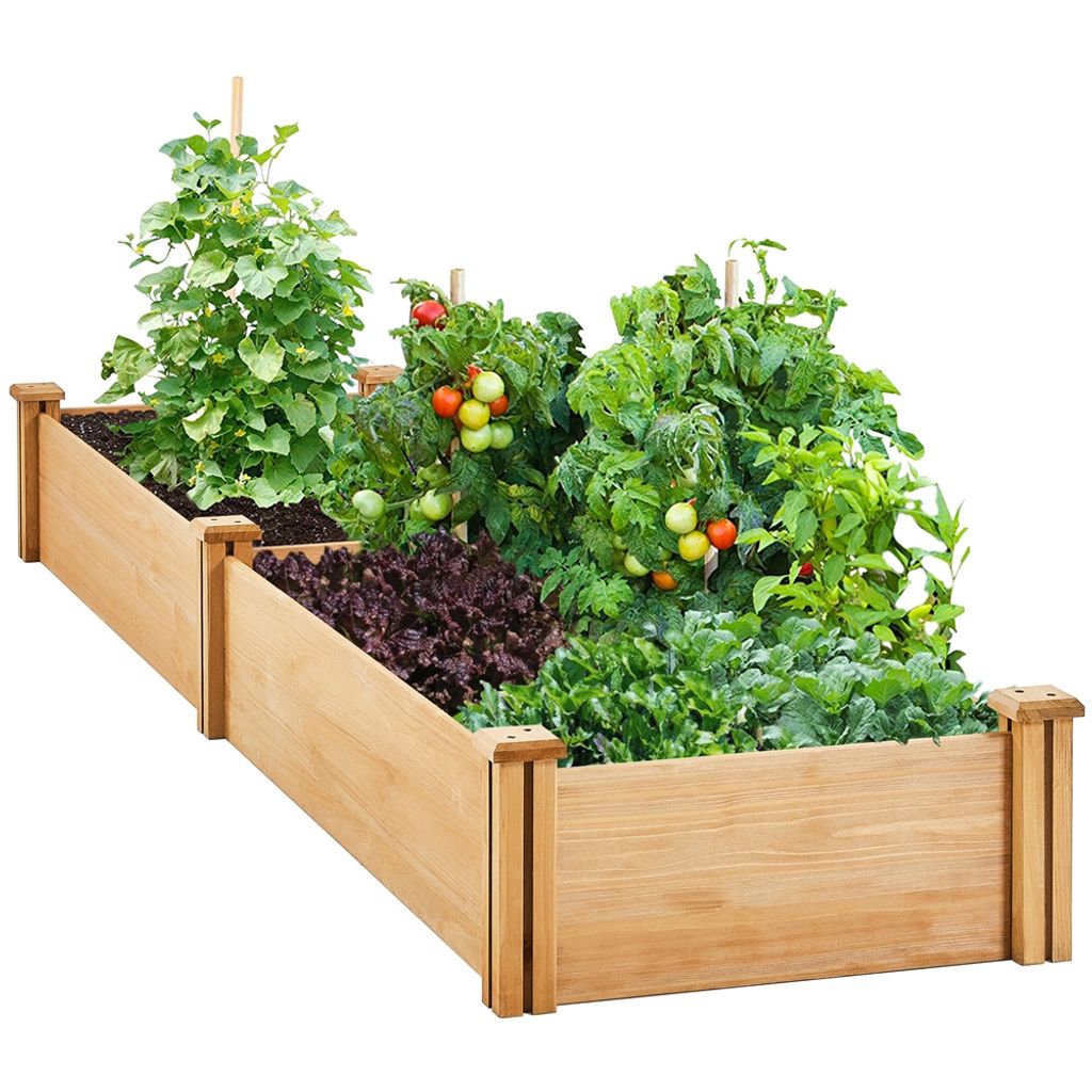 A wooden raised garden bed filled with various plants, including tomatoes and lettuce.