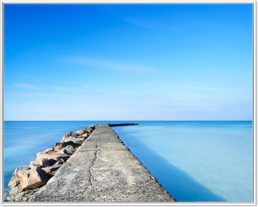 Wallario Wandbild Pier am blauen Ozean mit blauem Himmel, Größe: 40,30 x 50,30 cm, Poster mit weißem Aluminiumrahmen