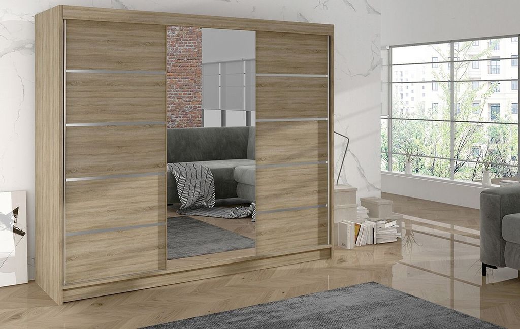 A bedroom scene featuring a large wardrobe with mirrored doors, next to a window with a view of trees.