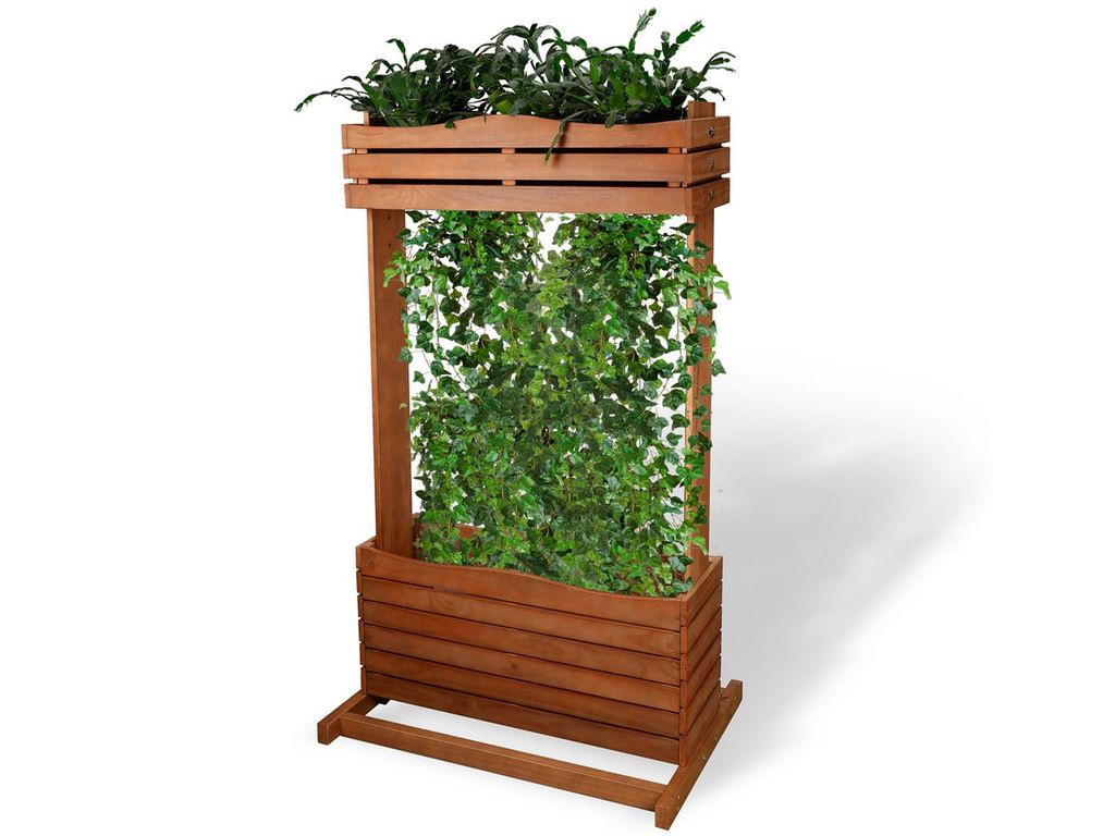 A wooden planter with green plants on a white background.