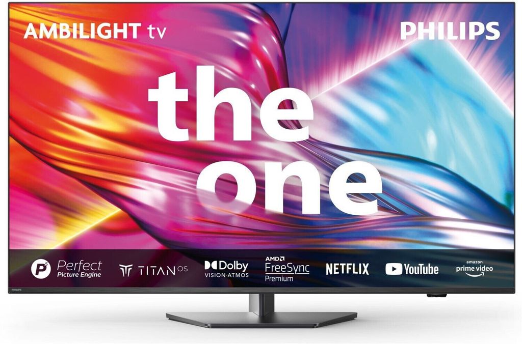 A Philips Ambilight TV displaying colorful abstract graphics with text overlay.