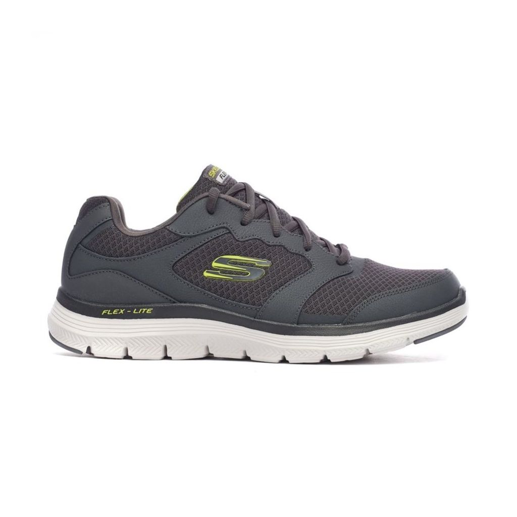 A side view of a gray Skechers sneaker with yellow accents, isolated on a white background.