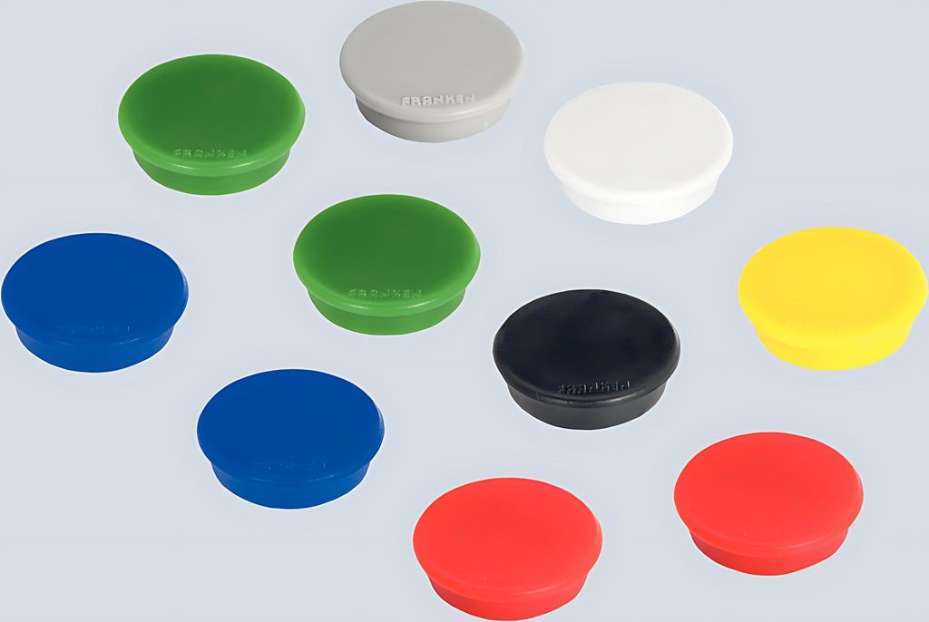 A collection of round magnets in various colors.