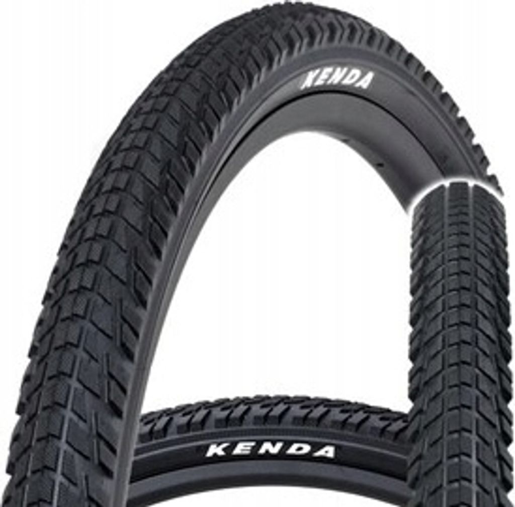 Two bicycle tires are shown against a white background. The front tire is curved and the brand name "KENDA" is visible on its sidewall. A portion of a second tire is visible behind the first.
