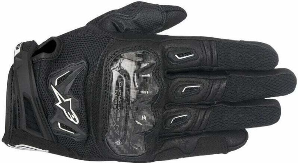 A black motorcycle glove shown from the top.