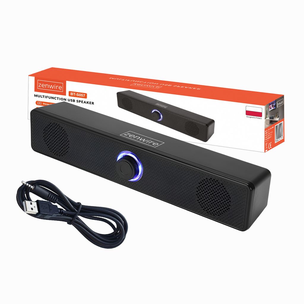 A black computer soundbar speaker and its charging cable are displayed on a white background, with the product's packaging visible in the background.