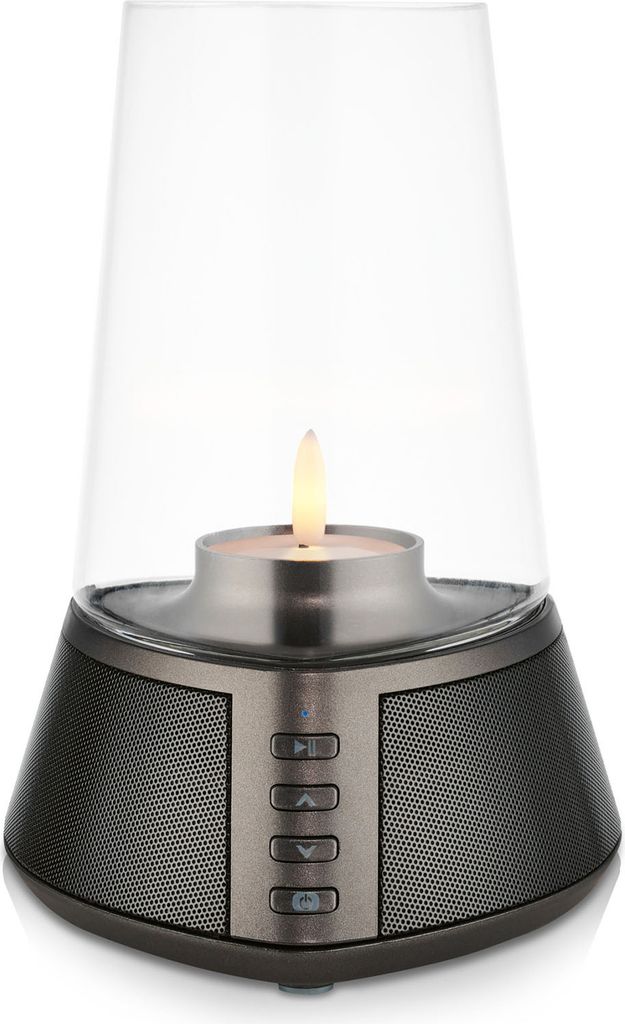A product shot of a Bluetooth speaker with a candle-like light.