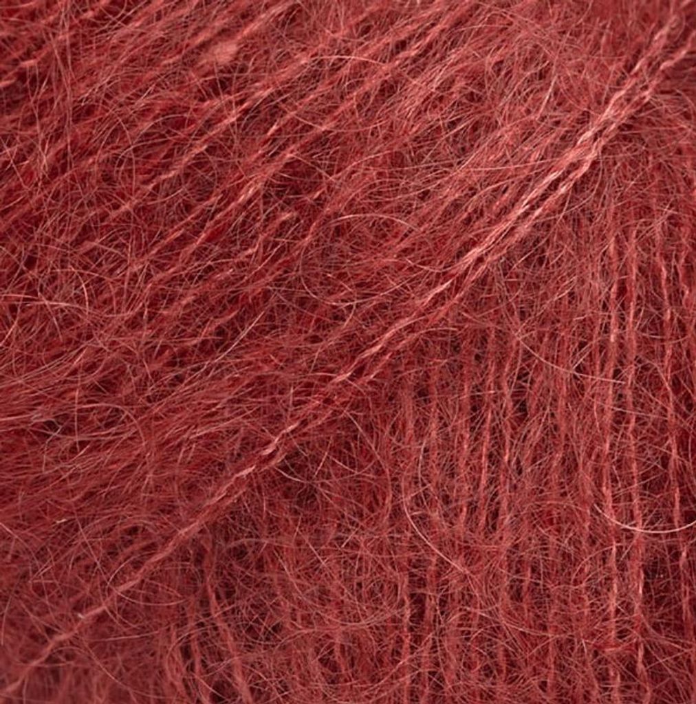 A close-up view of red yarn.