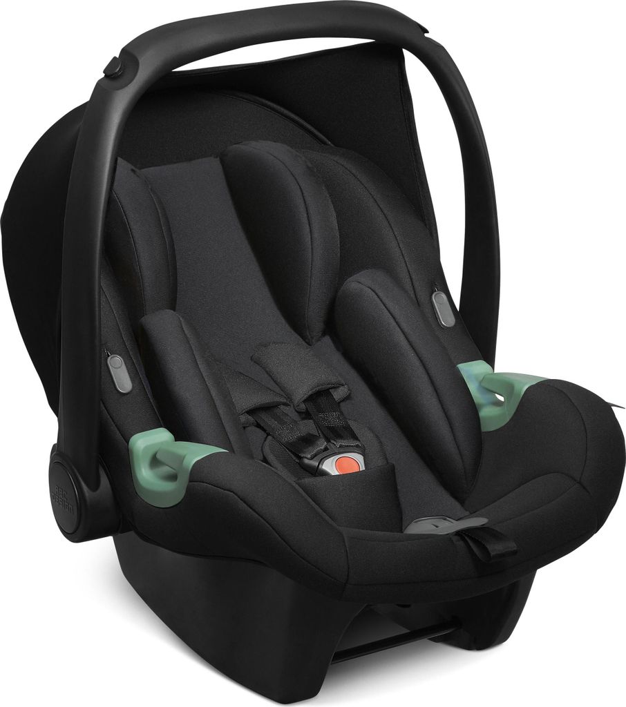 A black baby car seat with green accents, shown from a front-side angle against a white background.