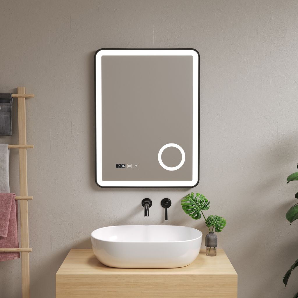 A modern bathroom vanity with a sink and a lighted LED mirror.