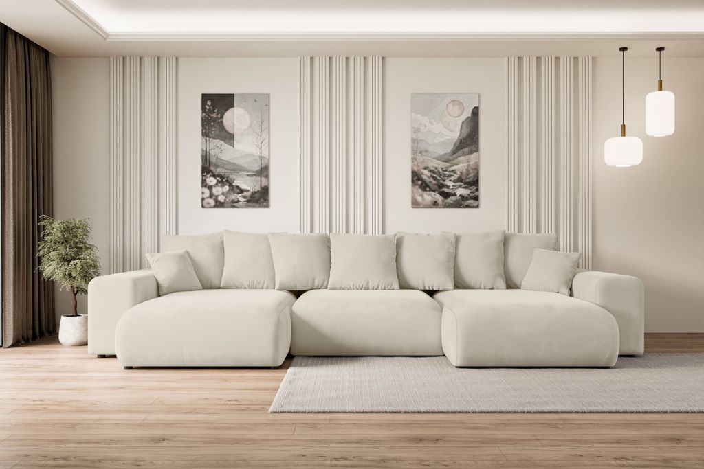 A spacious U-shaped sofa is centrally placed in a modern living room, with artwork on the wall and pendant lights overhead.