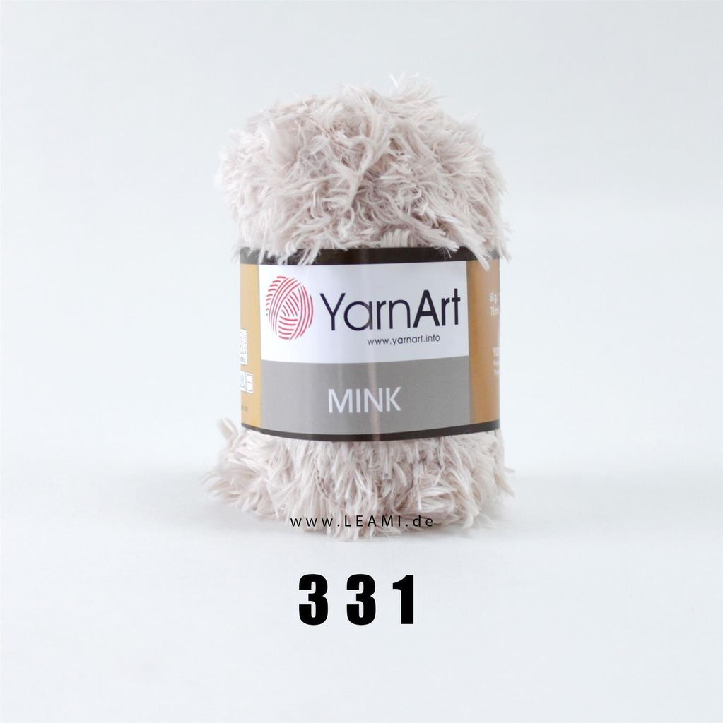 A ball of YarnArt Mink yarn on a white background.