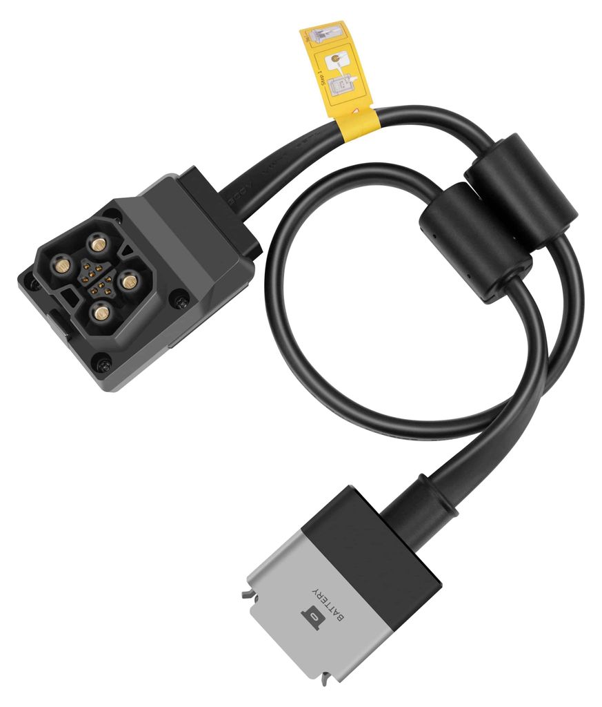 A product shot of an adapter cable with two connectors and a yellow tag.