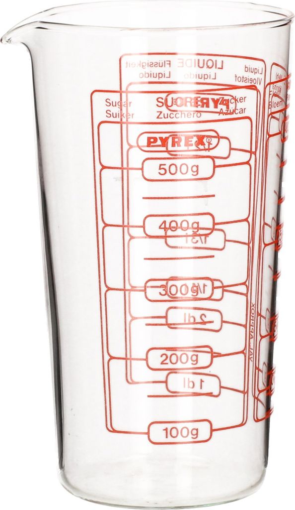 A clear, front-facing shot of a Pyrex measuring cup with red markings for volume and weight.
