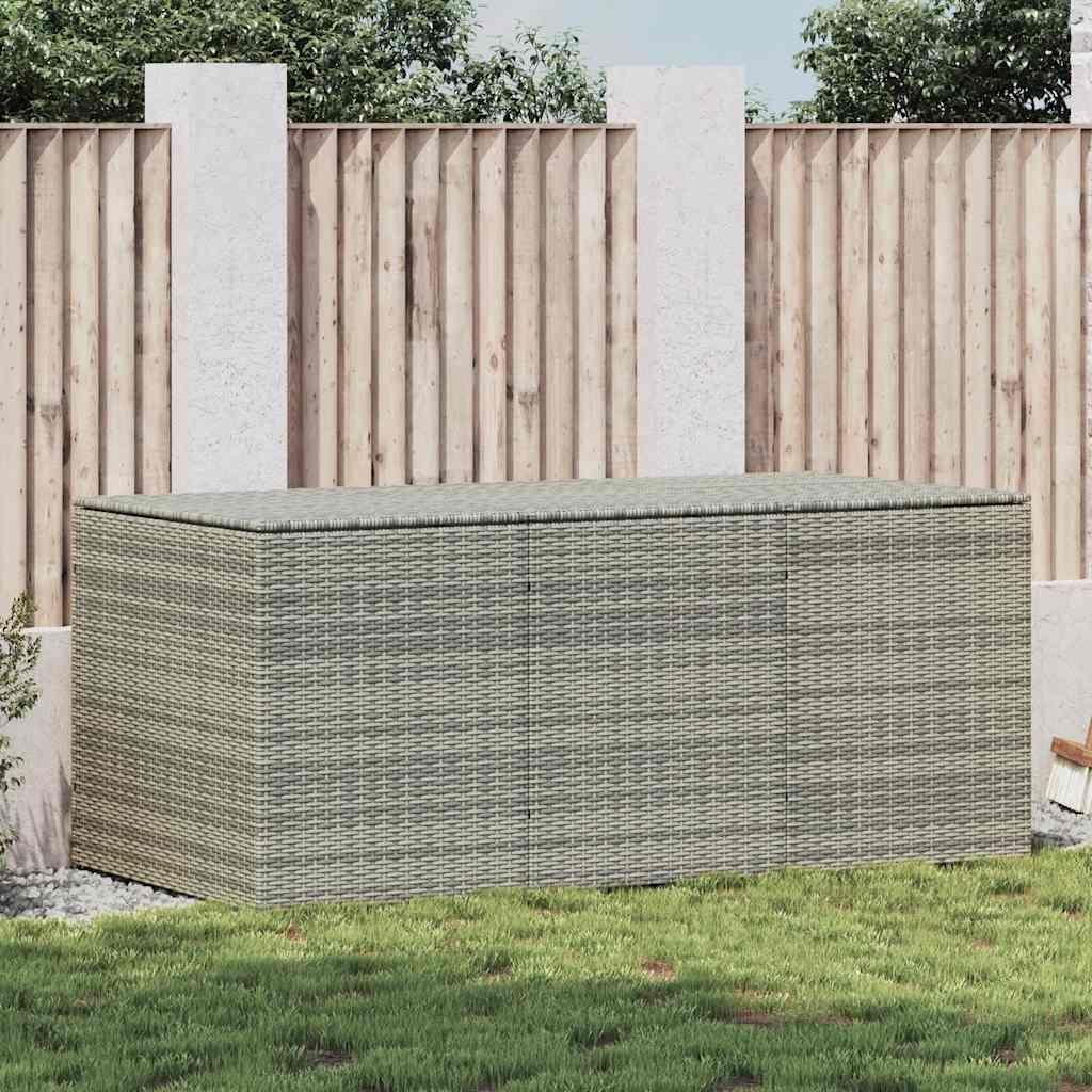A poly rattan garden box is placed on a lawn in front of a wooden fence.