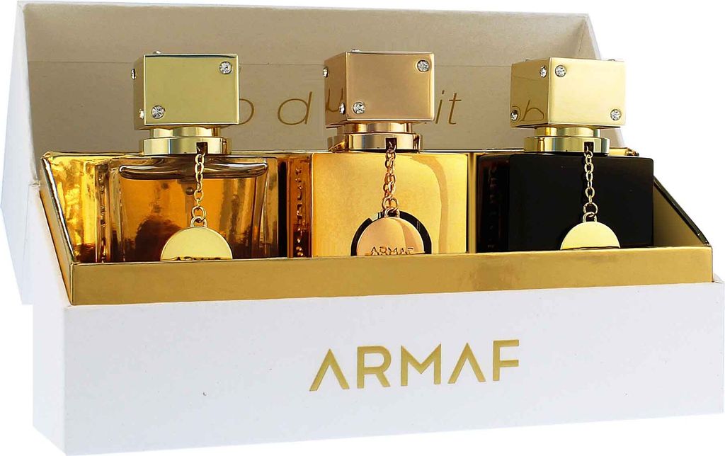 A gift set of three Armaf perfumes in a white and gold box.