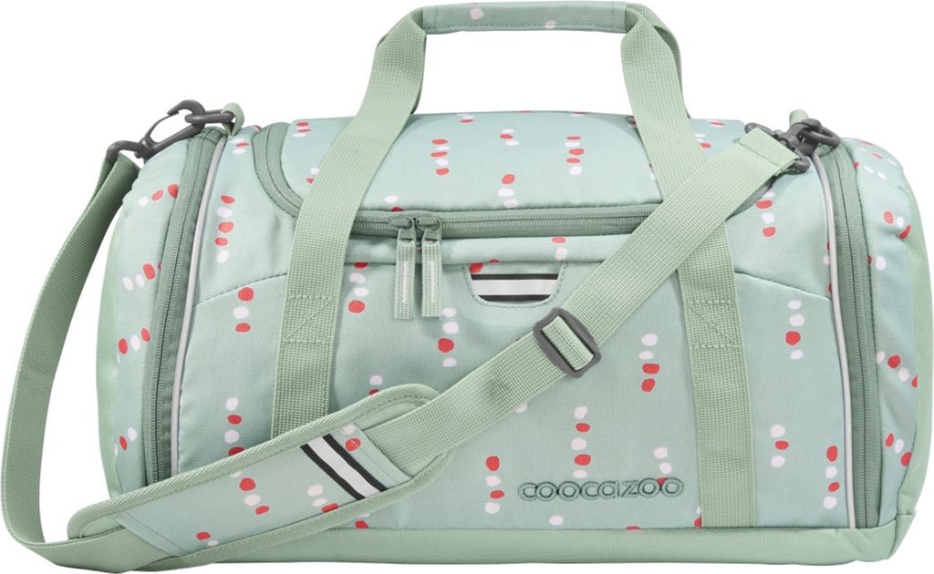 A mint green duffel bag with a polka dot pattern.