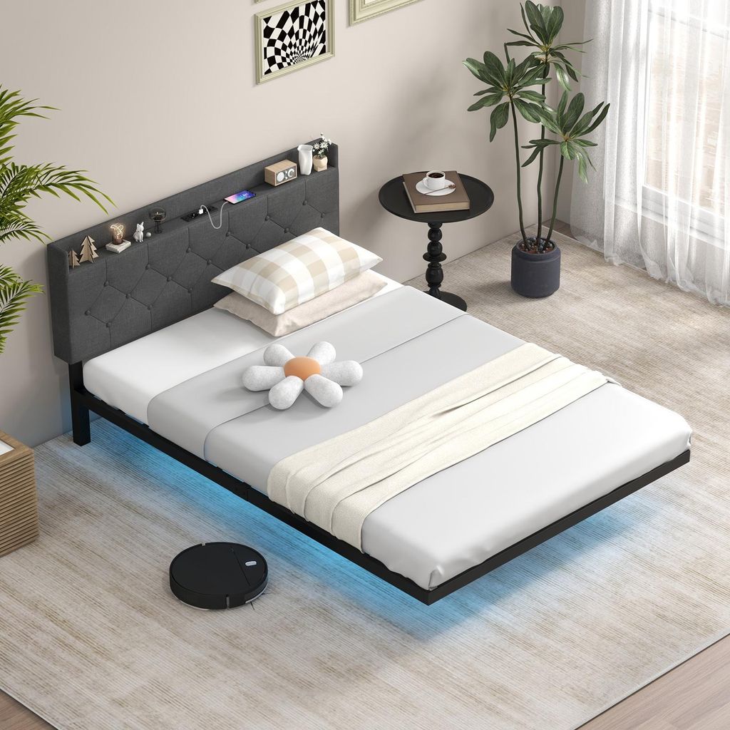 A bedroom scene with a bed, nightstand, and plants.