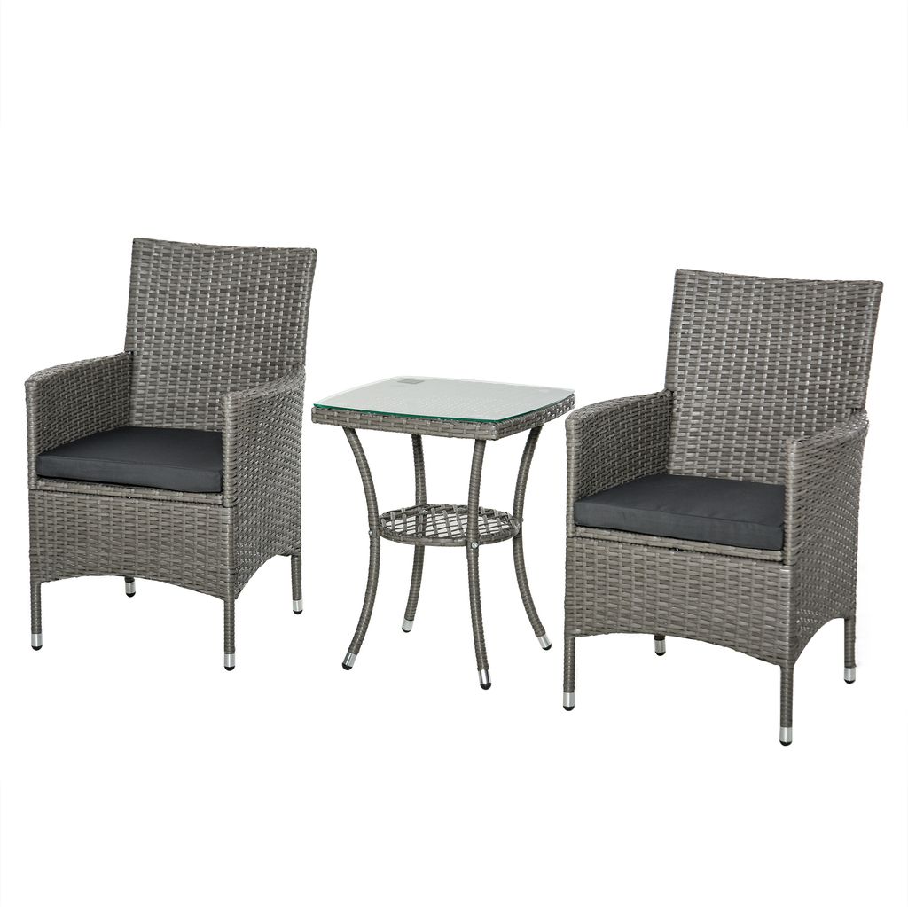 A gray rattan garden seating set with a glass-topped table and two chairs, presented on a white background.