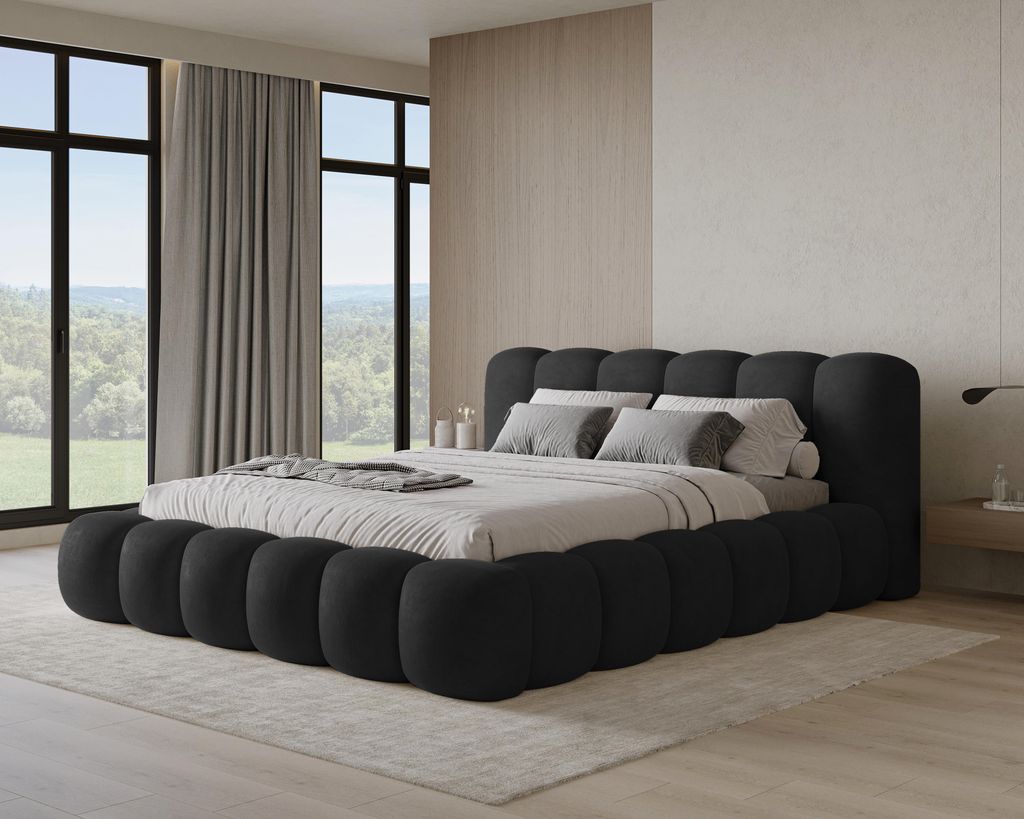 A modern bedroom with a large bed, large windows with curtains, and a wooden accent wall.