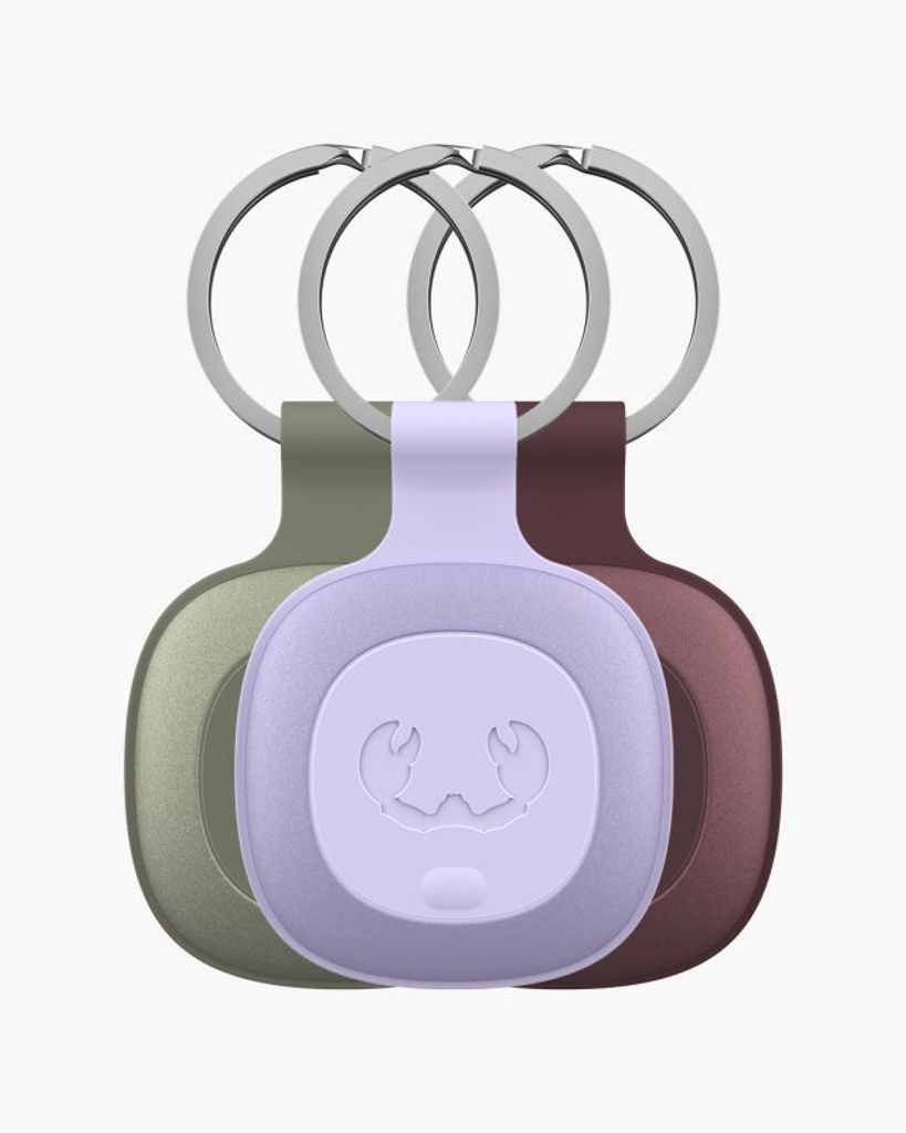 Three keychains with trackers in different colors are displayed against a white background.