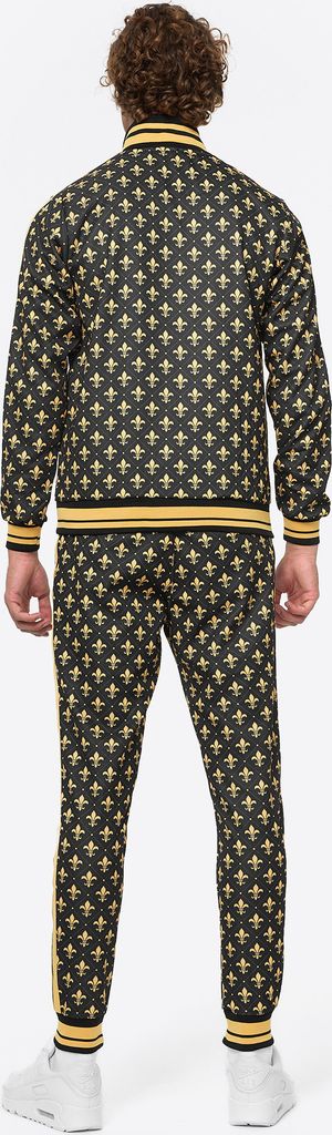A person wearing a black and gold patterned tracksuit, viewed from the back.