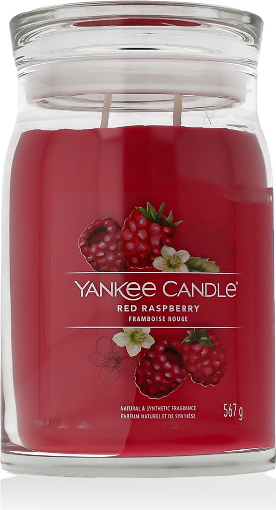A Yankee Candle Red Raspberry scented candle in a glass jar with a lid.