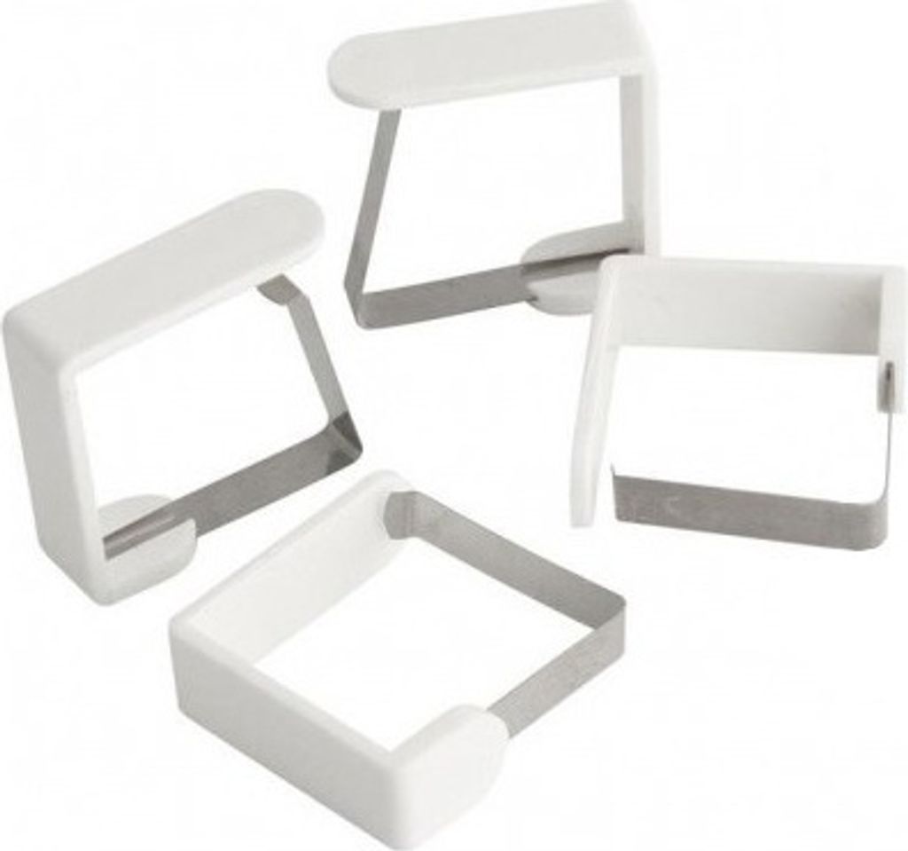 Four white and silver tablecloth clips are arranged diagonally on a white background.