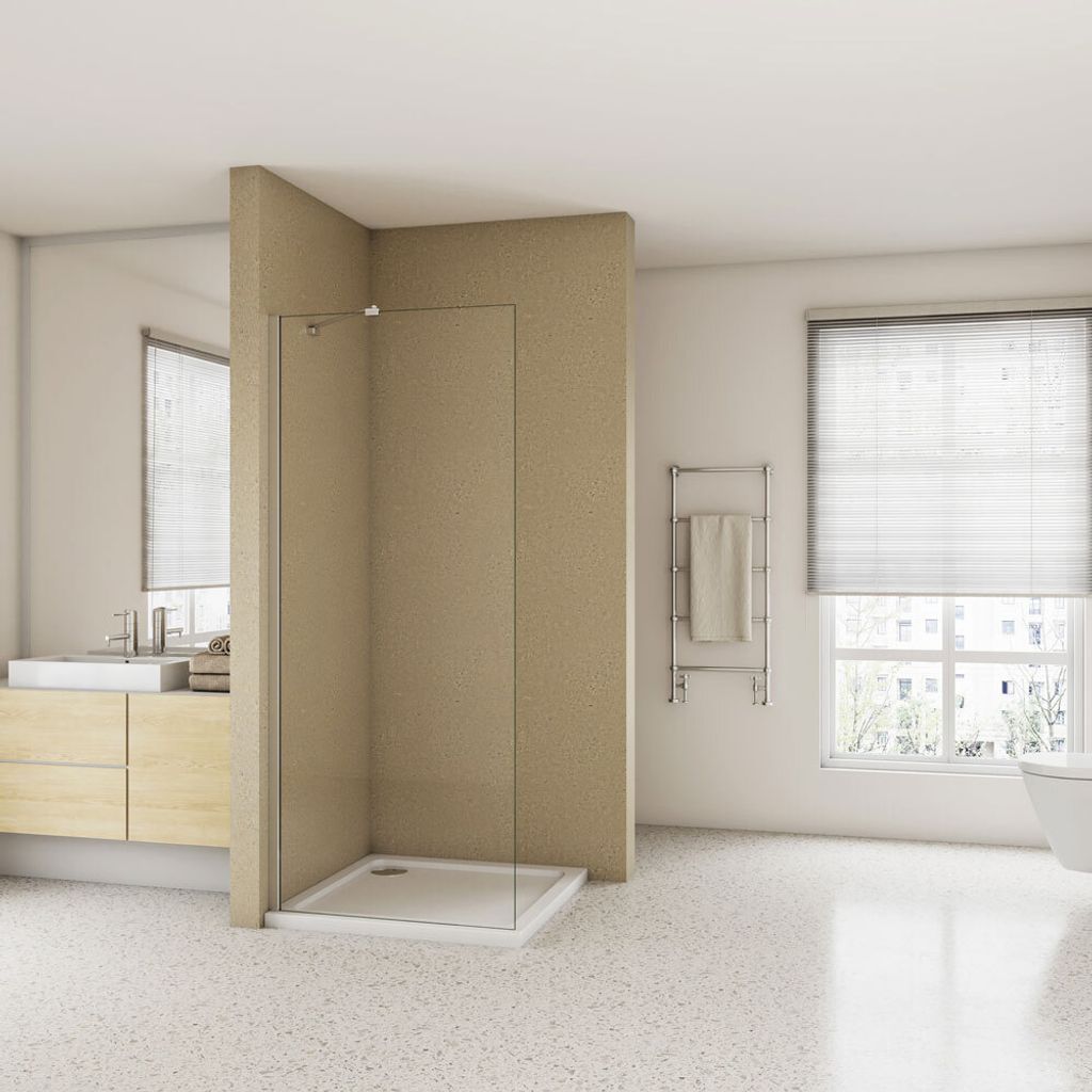 A modern bathroom with a walk-in shower, vanity, and towel rack.