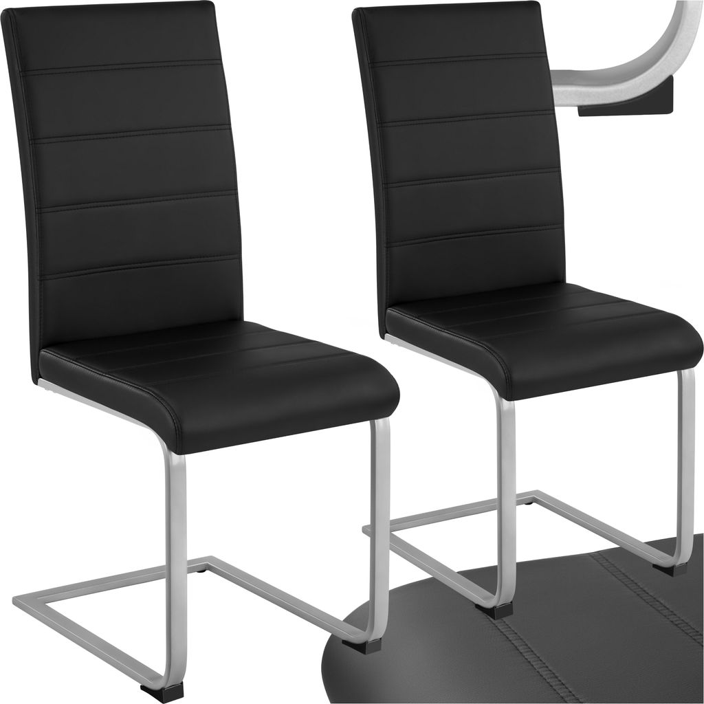 Two black dining chairs with silver legs are shown against a white background.