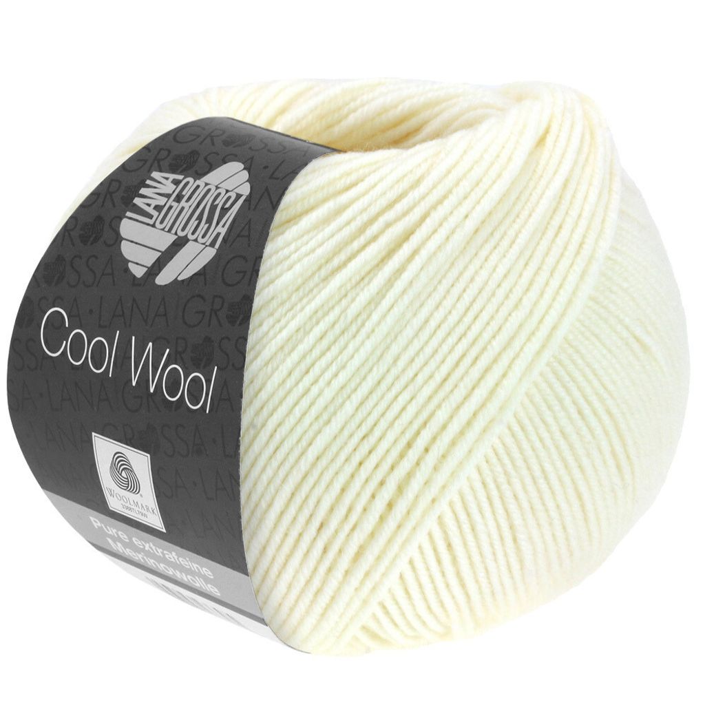 A ball of cream-colored yarn with a dark label.
