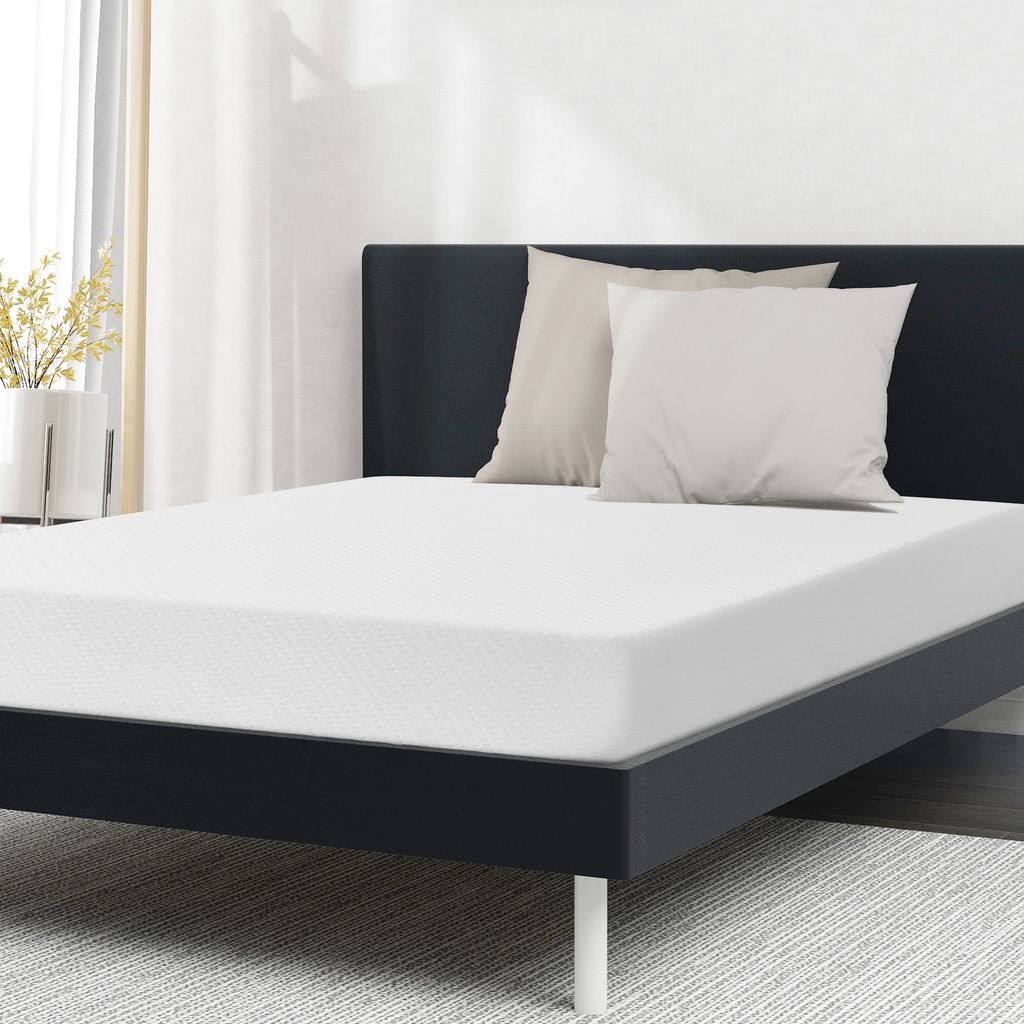 A mattress on a bed frame with two pillows.