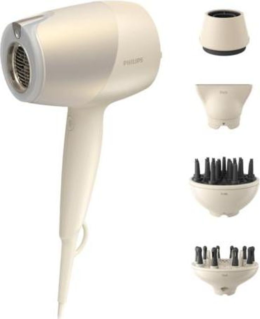 A hair dryer and its attachments are displayed against a white background.