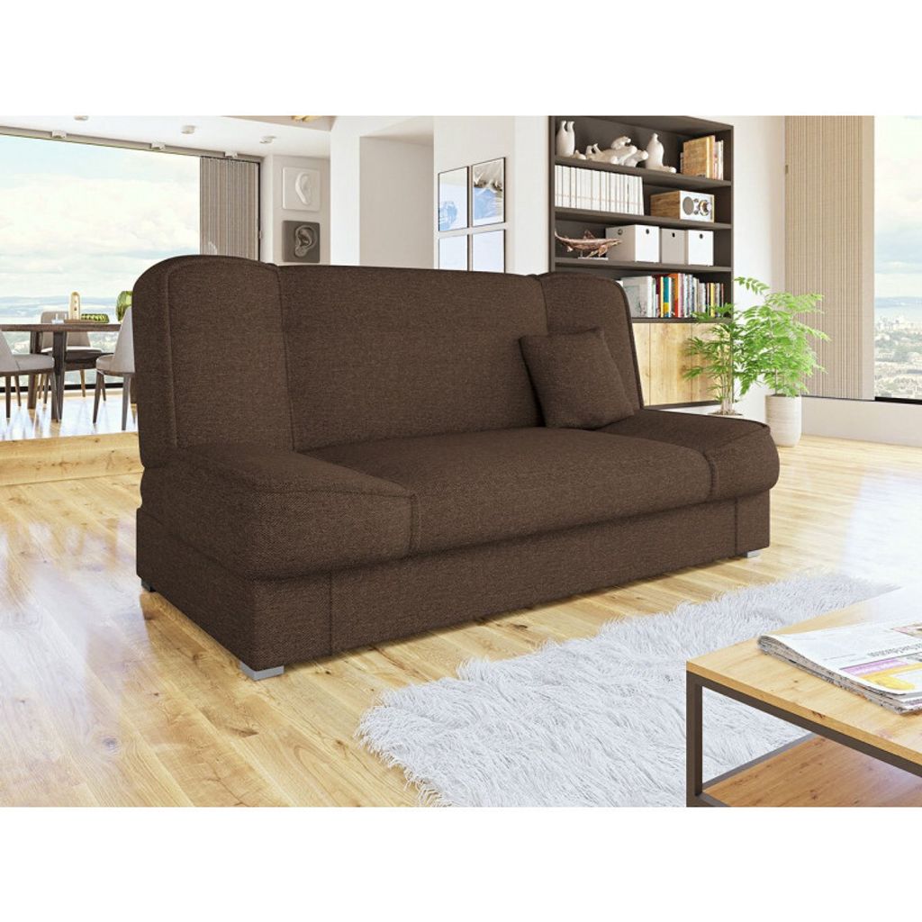 A brown sofa bed is shown in a living room setting, with a bookshelf and a dining area visible in the background.